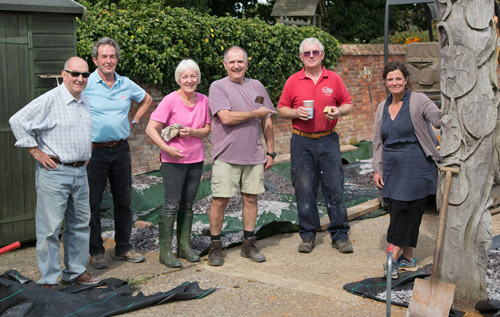 Left to right: George Forster, Roy Sherlock, Manesty Forster, John Pickering, Cliff Harmer and Karen Phelps help prepare the Japanese garden at Reepham Primary School