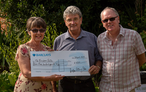 Richard Cooke of Reepham & District Rotary Club (centre) presents a cheque for '£500 to Bircham Centre trustees Brenda Green (chair) and Les West (vice chair). Photos: John Tym