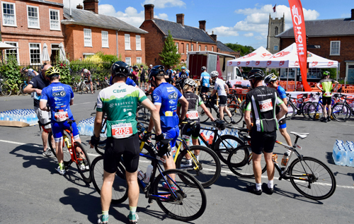 Pit stop in Reepham's Market Place for the recreational riders on the British Cycling Challenge 100 Sportive. Photo: Charles Butcher