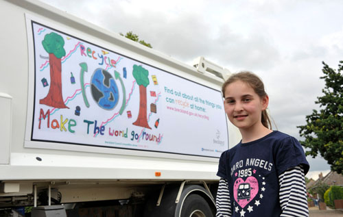 Lyng Church of England Primary School student Katie Leigh with her prize-winning picture that now adorns one of Breckland District Council's waste collection vehicles 