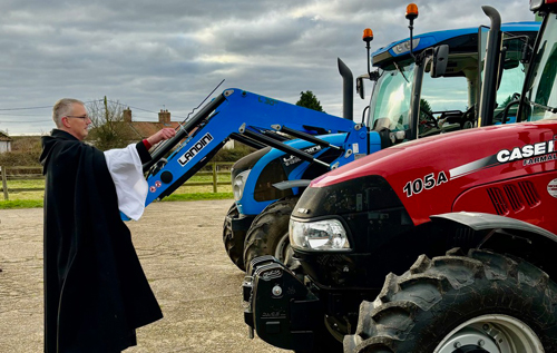 Rev. Andrew Whitehead, Team Vicar for the Western Parishes of the Aylsham & District Team Ministry, blesses the ploughs'. Photo: Rebecca Whitehead