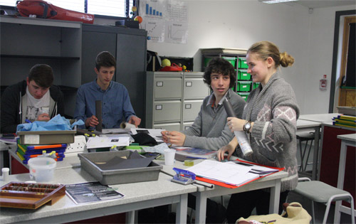 Sixth form students studying the observatory telescopes