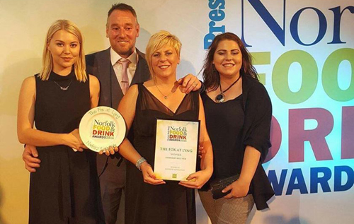 Gavin and Victoria Hunt in the centre with daughters Erin (left) and Meg