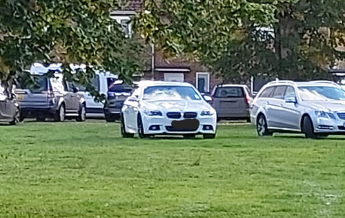 Cars parked on the children's play area on Sun Barn Road, Reepham. Photo: Facebook